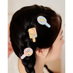 Barrettes Likio petit déjeuner portées dans une tresse