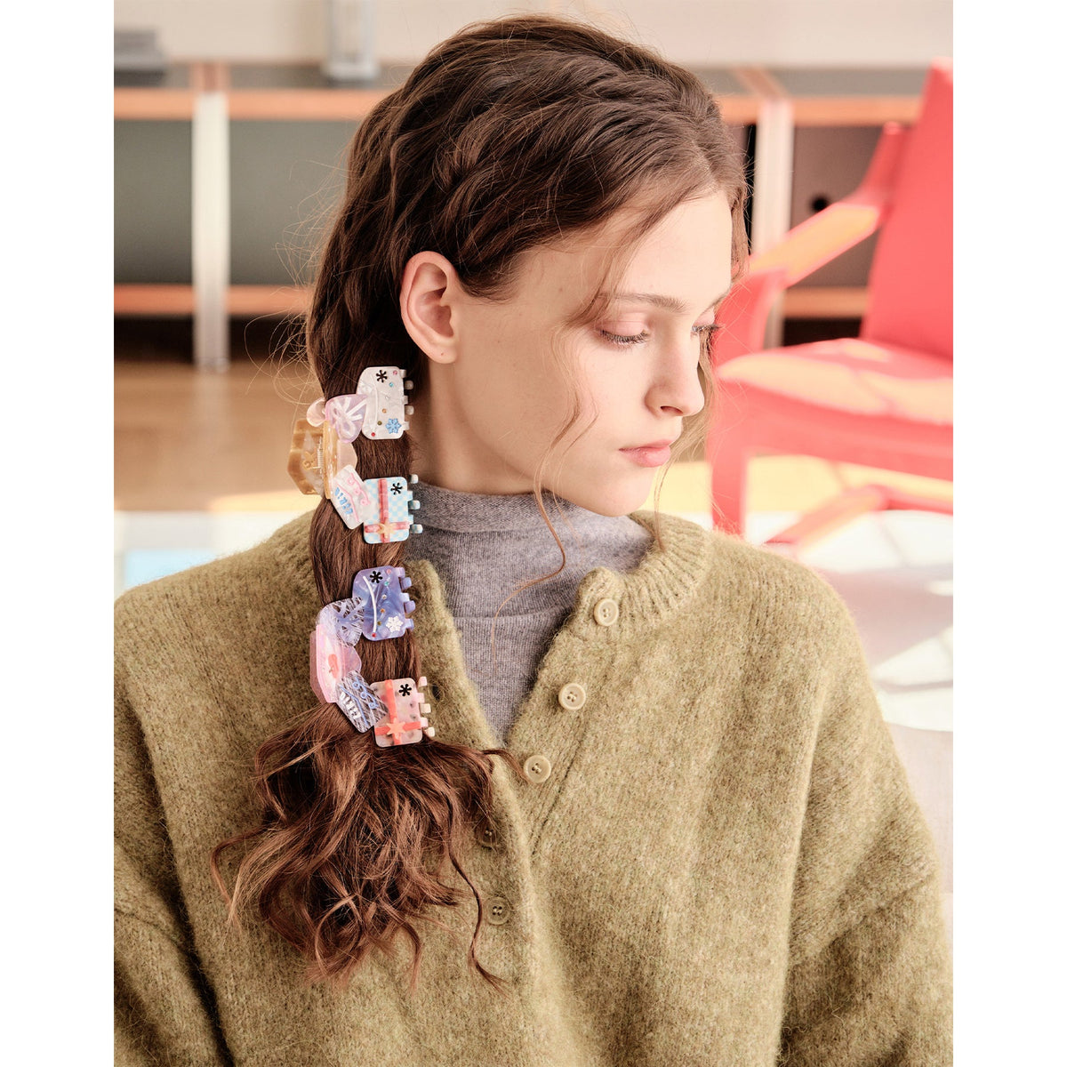 Likio gift shaped hair claws worn in a long braid