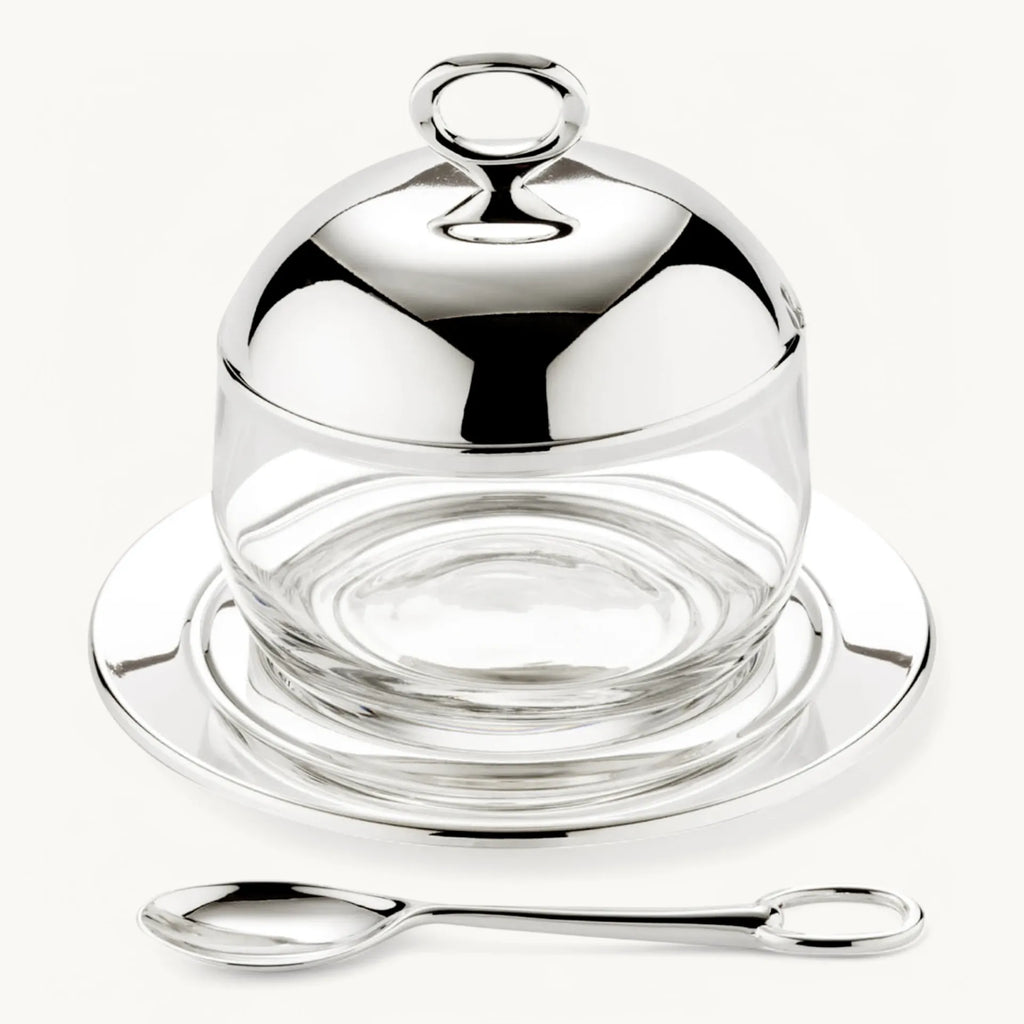 Jam jar with coaster and spoon