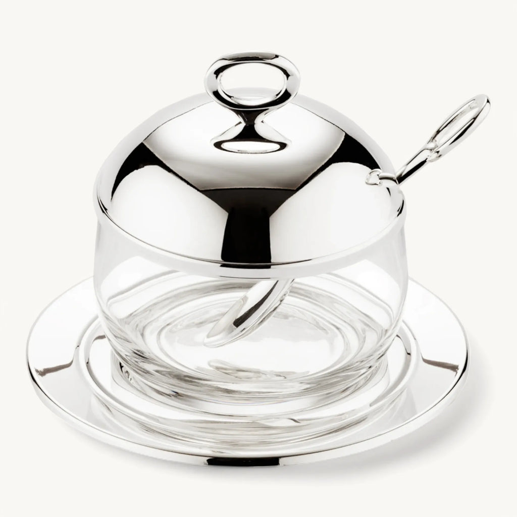 Jam jar with coaster and spoon