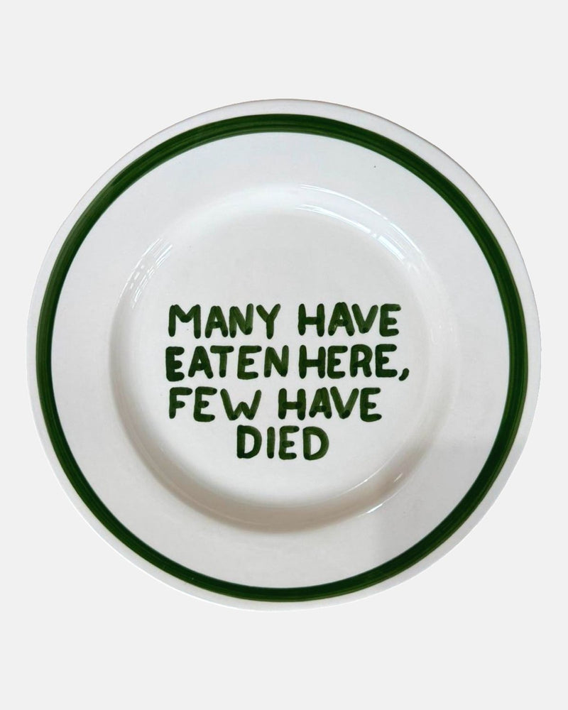 'Many have eaten here, few have died' bord — ø27cm
